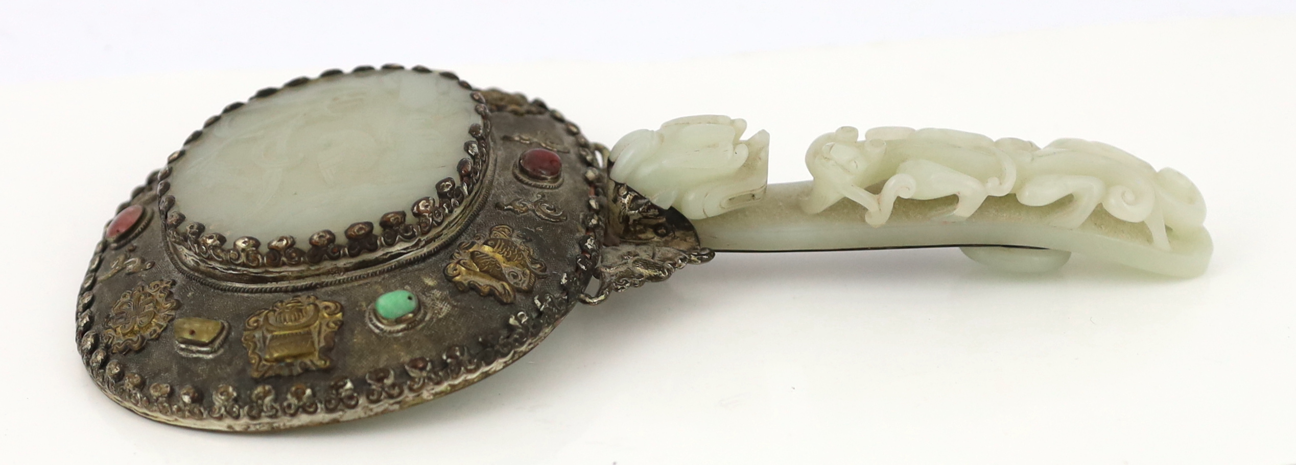 A Chinese celadon jade mounted hand mirror, the jade 18th/19th century